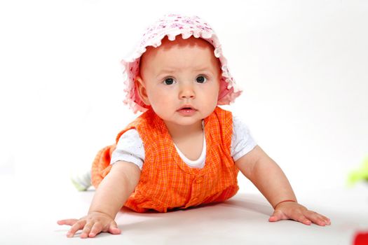 A little baby-girl crawling on the floor