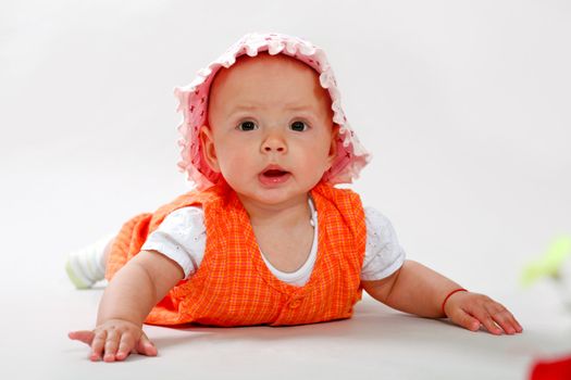 An image of cute baby in a studio