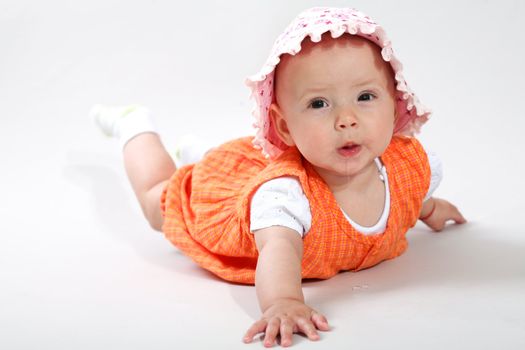 An image of cute baby in a studio