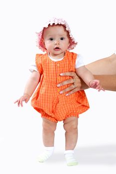 An image of nice baby in orange shirt