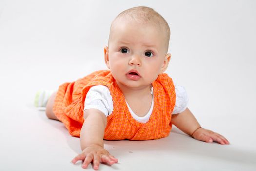 A little baby-girl crawling on the floor