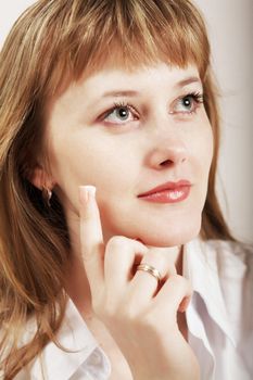 Stock photo: an image of a woman putting cream onto her face