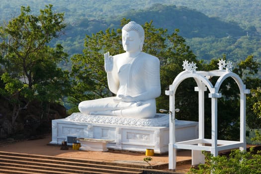White sitting Budha image. Mihintale, Sri Lanka