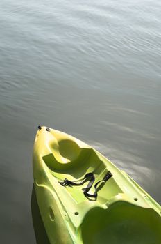 Detail of a plastic kayak standing in the water