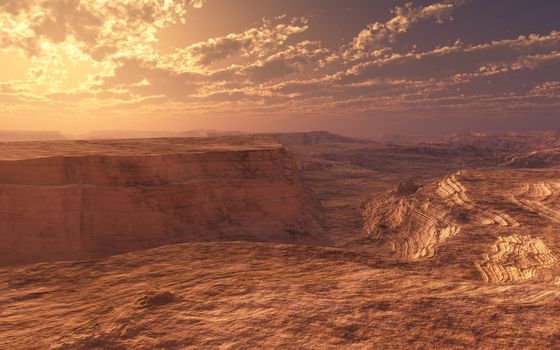 This image shows a dry canyon with sunset