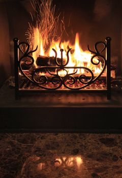 Fire with sparks in a beautiful fireplace