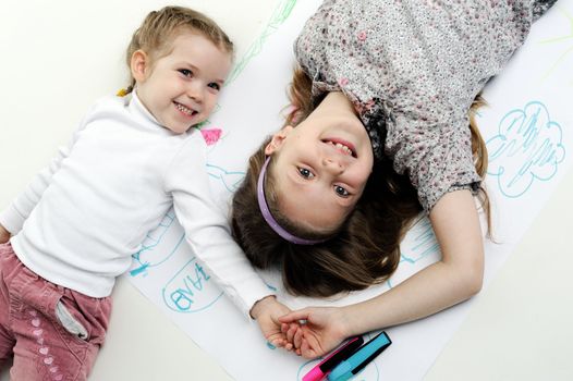 An image of two nice little sisters laughing