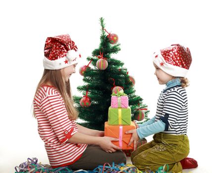 Two little girls at the new year tree