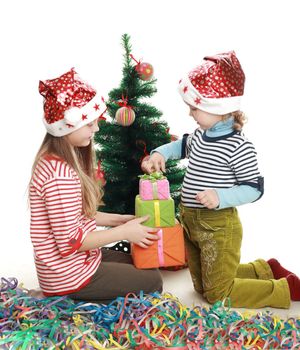 Two little girls at the new year tree