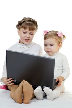 Stock photo: an image of two little girls with laptop