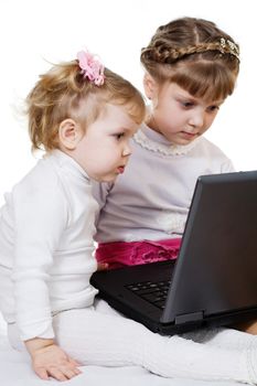 Stock photo: an image of two little girls with laptop