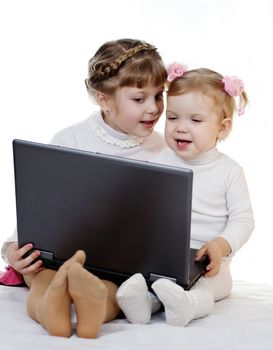 Stock photo: an image of two girls with laptop