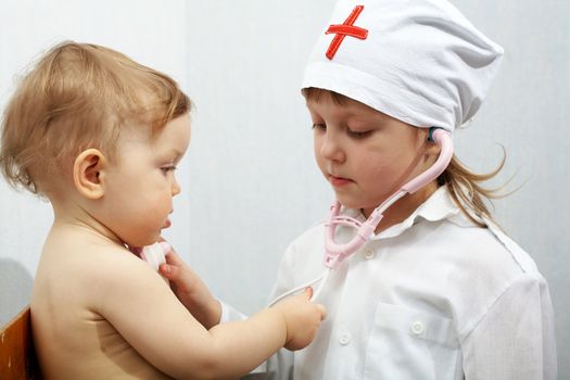 An image of child playing in doctor