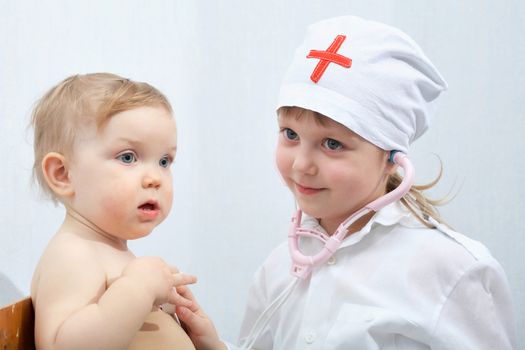 An image of child playing in doctor