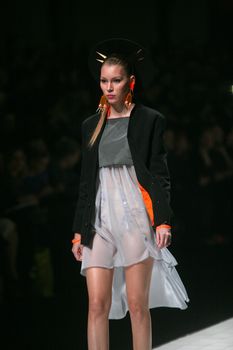 ZAGREB, CROATIA - MARCH 15: Fashion model wears clothes made by design group "Clash of 9" on "Dove FASHION.HR" show on March 15, 2012 in Zagreb, Croatia.