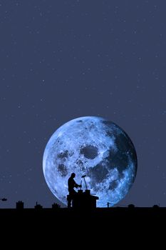 silhouette of a chimney sweep at work on the rooftop of a housing estate with moonlit sky in background