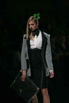 ZAGREB, CROATIA - MARCH 15: Fashion model wears clothes made by design group "Clash of 9" on "Dove FASHION.HR" show on March 15, 2012 in Zagreb, Croatia.