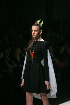 ZAGREB, CROATIA - MARCH 15: Fashion model wears clothes made by design group "Clash of 9" on "Dove FASHION.HR" show on March 15, 2012 in Zagreb, Croatia.