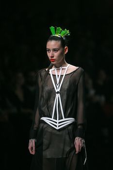 ZAGREB, CROATIA - MARCH 15: Fashion model wears clothes made by design group "Clash of 9" on "Dove FASHION.HR" show on March 15, 2012 in Zagreb, Croatia.