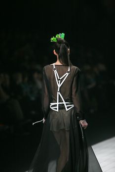 ZAGREB, CROATIA - MARCH 15: Fashion model wears clothes made by design group "Clash of 9" on "Dove FASHION.HR" show on March 15, 2012 in Zagreb, Croatia.