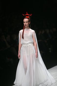 ZAGREB, CROATIA - MARCH 15: Fashion model wears clothes made by design group "Clash of 9" on "Dove FASHION.HR" show on March 15, 2012 in Zagreb, Croatia.