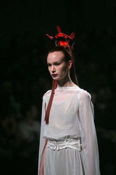ZAGREB, CROATIA - MARCH 15: Fashion model wears clothes made by design group "Clash of 9" on "Dove FASHION.HR" show on March 15, 2012 in Zagreb, Croatia.