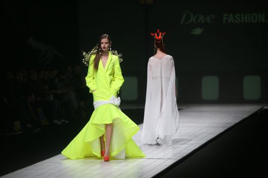 ZAGREB, CROATIA - MARCH 15: Fashion model wears clothes made by design group "Clash of 9" on "Dove FASHION.HR" show on March 15, 2012 in Zagreb, Croatia.