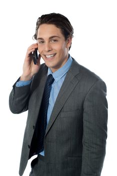 Portrait of a smiling businessman using a cellphone looking at you