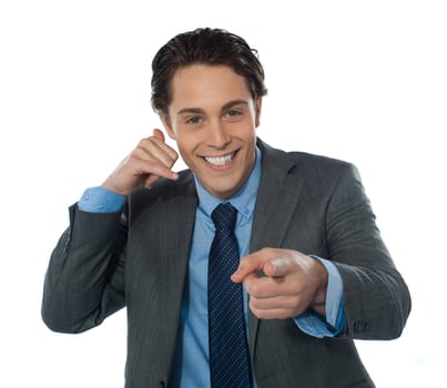 Male executive gesturing call with hands pointing at you