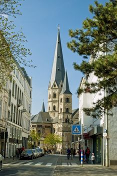 Center of Bonn, street and view on Minster, one of the oldest churches in Germany, emblem of the City of Bonn