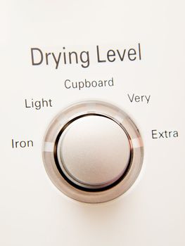 Program button with selections on a dryer machine