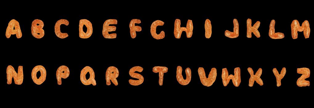 Letters of the British alphabet made of gingerbread over black background