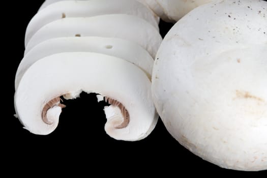 Picture of slices of mushroom on black