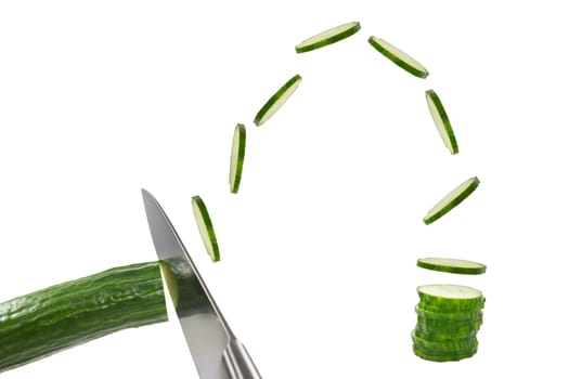 Picture of someone chopping up cucumbers really fast and placing them in a row