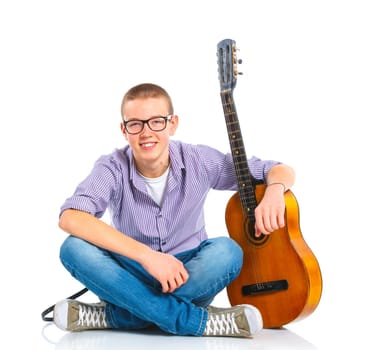 Cute boy sitting with classical guitar. Isolated on white background