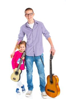 Cute boy and his sister with classical guitars. Isolated on white background