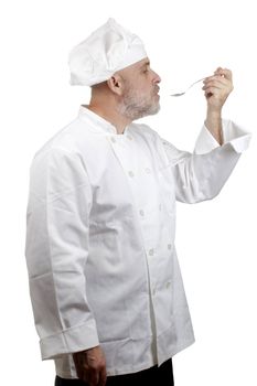 Portrait of a caucasian chef in his uniform on a white background.