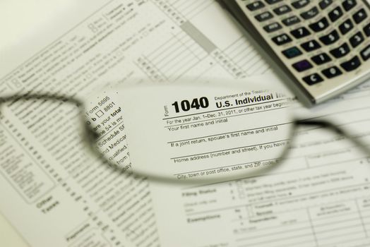 view of 1040 tax form through glasses, focused only in lens