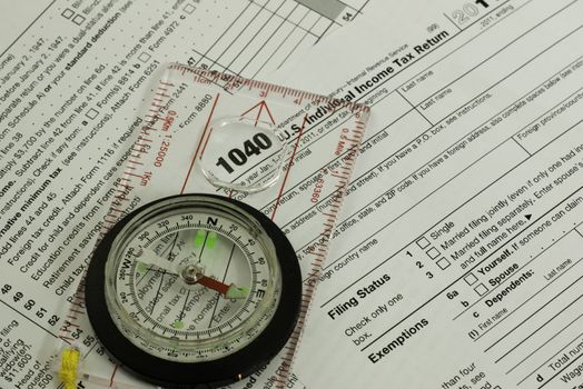 1040 tax form with a compass guidance concept, 1040 viewed inside compass