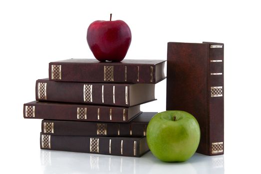 The tower of the books with apples, isolated on white background