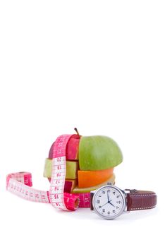 Fruit mix with tape measure and watch, isolated on white