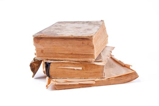 Pile of old books isolated on white background