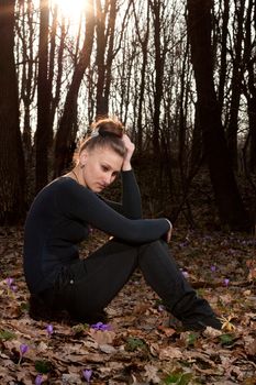 beautiful girl on the background of the spring forest