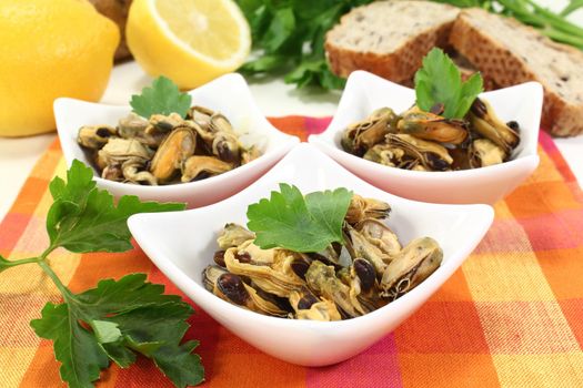 a bowl of marinated mussels and parsley