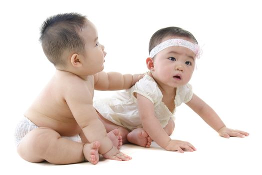 Full body two Asian baby sitting on white background