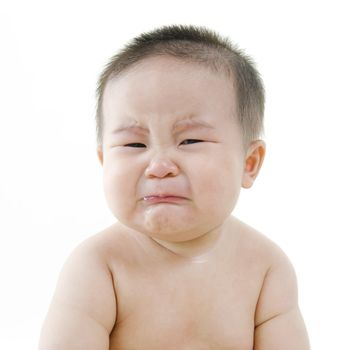 Crying Asian baby on white background