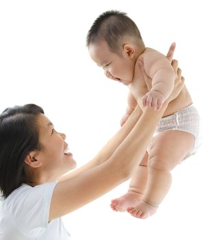 Asian mother playing with her baby boy