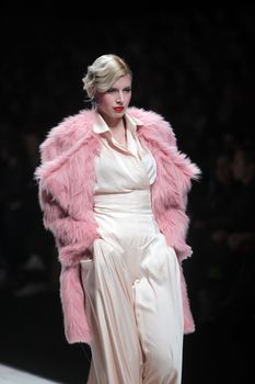 ZAGREB, CROATIA - MARCH 16: Fashion model wears clothes made by Aleksandra Dojcinovic on "Dove FASHION.HR" show on March 16, 2012 in Zagreb, Croatia.