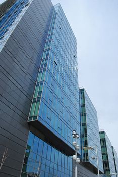 Modern office building side, blue glass windows