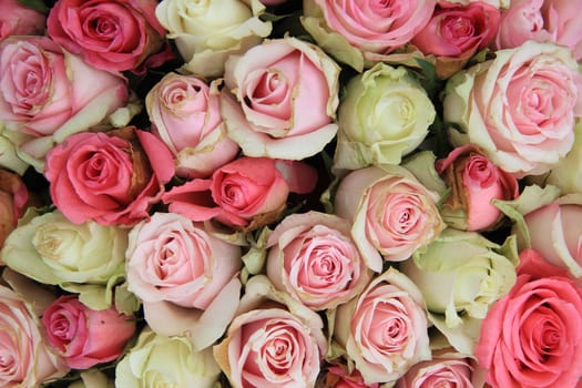 Detail of a wedding centerpiece, different shades of pink roses